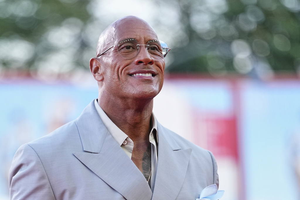 Dwayne Johnson poses for photographers on the red carpet for the film 'The Smashing Machine' during the 82nd edition of the Venice Film Festival in Venice, Italy, on Monday, Sept. 1, 2025. (Photo by Scott A Garfitt/Invision/AP)