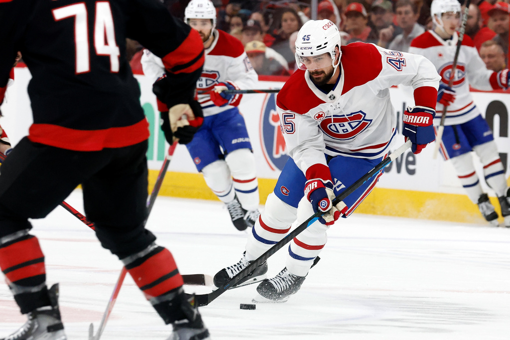 Montréal Canadiens' Alexandre Carrier (45) controls the puck against the Carolina Hurricanes during the first period in Game 1 of the Eastern Conference finals NHL hockey Stanley Cup playoffs series in Raleigh, N.C., Thursday, May 21, 2026. (AP Photo/Karl DeBlaker)