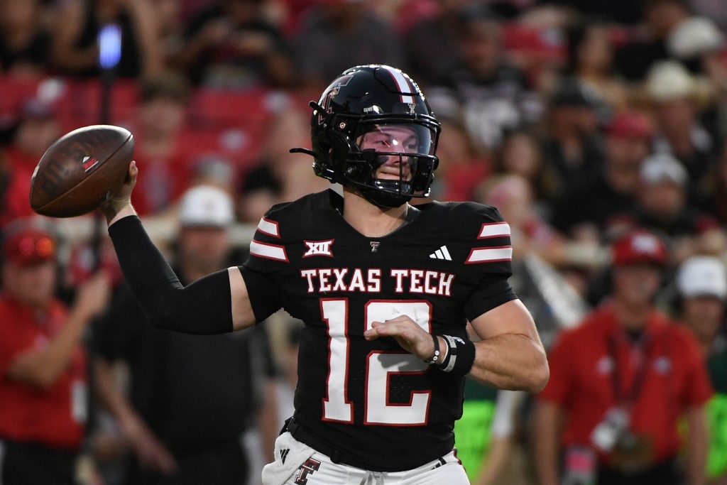 Texas Tech quarterback Mitch Griffis (12) drops back to throw against Central Florida during the second half of an NCAA college football game Saturday, Nov. 15, 2025, in Lubbock, Texas. (AP Photo/Justin Rex)