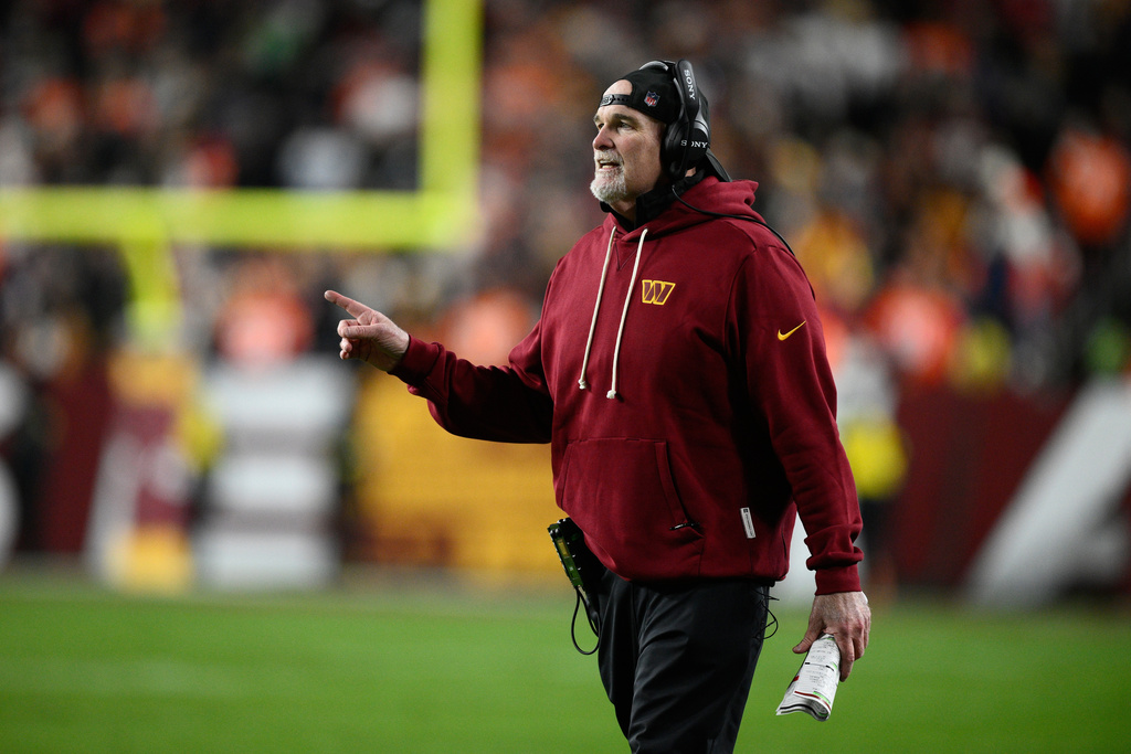 Washington Commanders head coach Dan Quinn watches from the sidelines during the first half of an NFL football game against the Denver Broncos Sunday, Nov. 30, 2025, in Landover, Md. (AP Photo/Nick Wass)