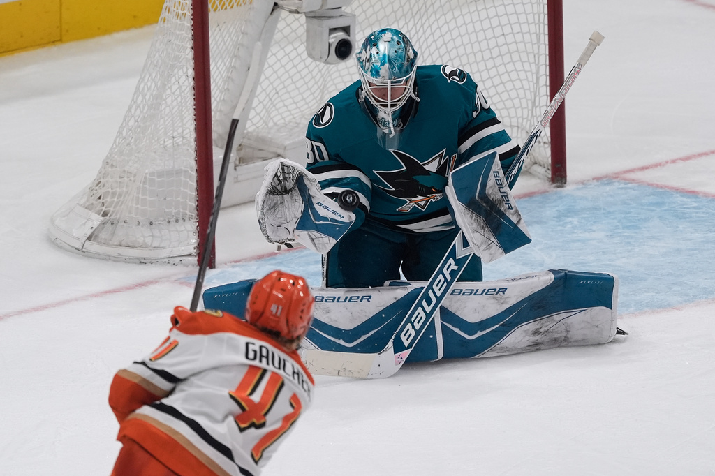 San Jose Sharks goaltender Yaroslav Askarov, top, defends against a shot by Anaheim Ducks center Nathan Gaucher (41) during the third period of an NHL hockey game in San Jose, Calif., Wednesday, April 1, 2026. (AP Photo/Jeff Chiu)