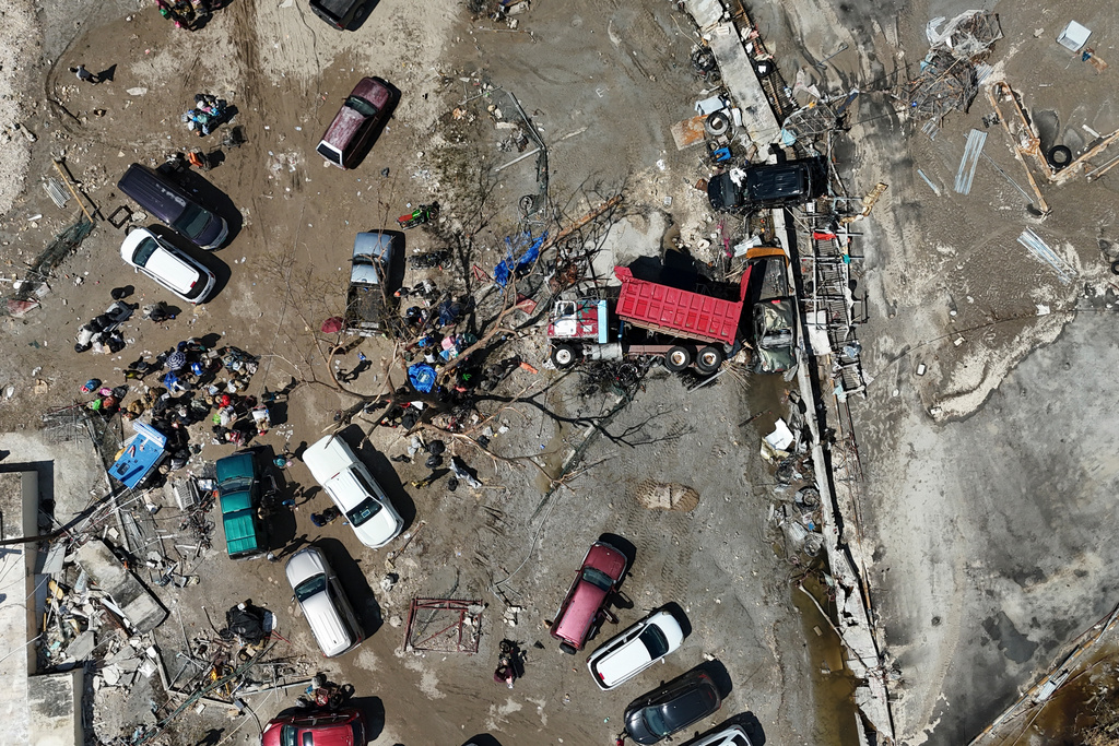 A truck lies overturned among debris in Black River, Jamaica, Thursday, Oct. 30, 2025, in the aftermath of Hurricane Melissa. (AP Photo/Matias Delacroix)