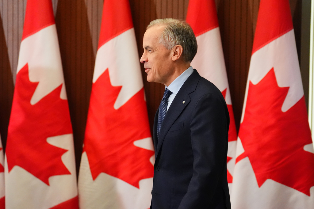 Prime Minister Mark Carney arrives for a news conference in Ottawa on Tuesday, April 14, 2026. (Sean Kilpatrick/The Canadian Press via AP)