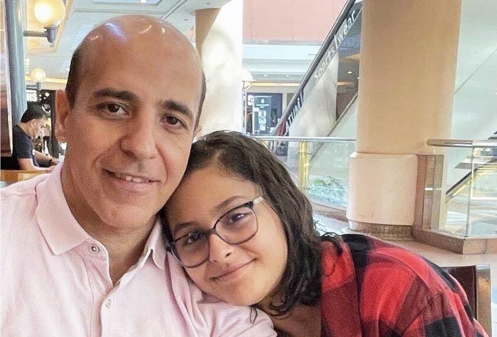 This 2023 photo provided by Safiah Mohammed shows Dr. Ali Almudhwahi, left, with his daughter, Youmna. (Safiah Mohammed via AP)