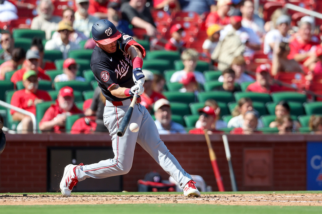 Washington Nationals' Jacob Young hits a single during the fourth inning of a baseball game against the St. Louis Cardinals, Sunday, Sept. 20, 2026, in St. Louis. (AP Photo/Scott Kane)