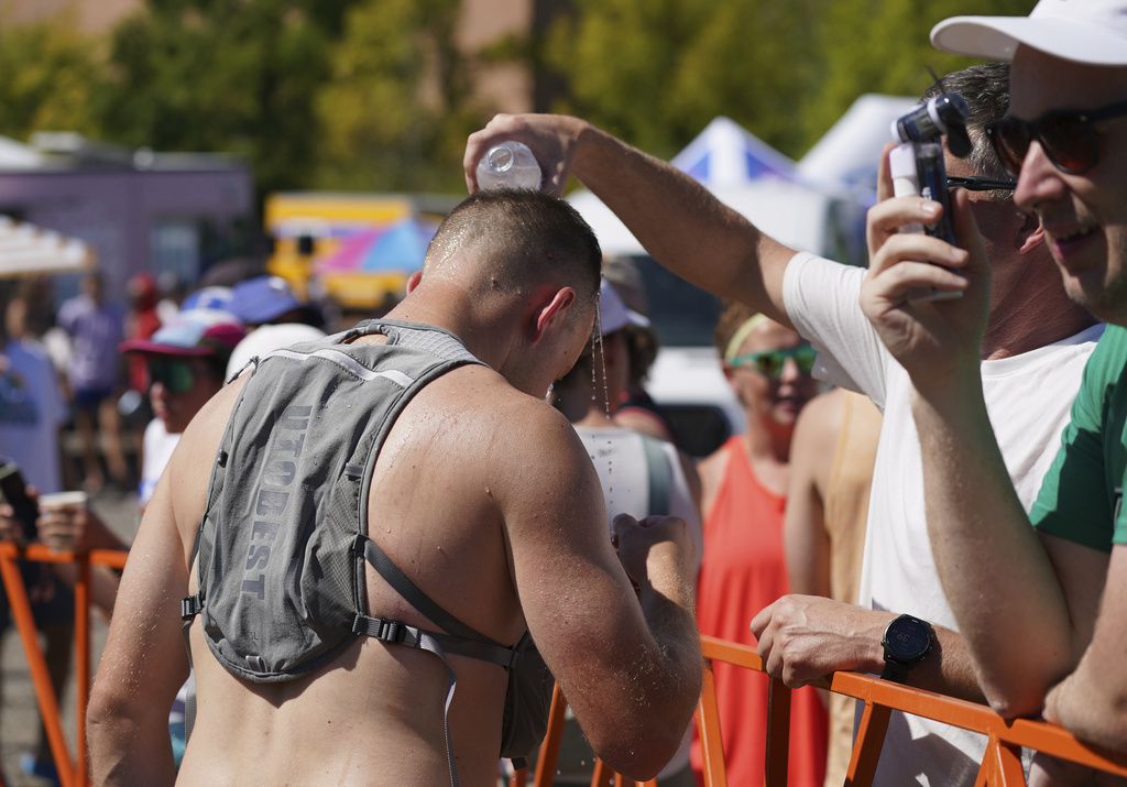 Hood to Coast relay race runners and supporters at Exchange Point 12 near Oregon Museum of Science and Industry in Southeast Portland, Friday, Aug. 22, 2025. (Teresa Mahoney/The Oregonian via AP)