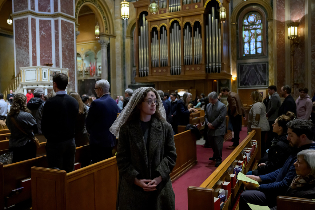 Ella Morone receives ashes during an Ash Wednesday Mass at the Cathedral of St. Matthew the Apostle, Wednesday, Feb., 18, 2026, in Washington. (AP Photo/Rod Lamkey, Jr.)