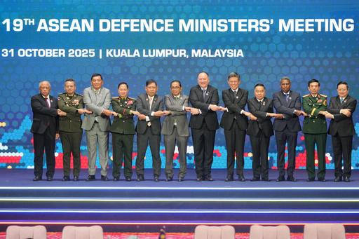 From left, Brunei's Defense Minister Halbi bin Haji Mohd Yussof, Cambodia's Defense Minister Tea Seiha, Indonesia's Defense Minister Sjafrie Sjamsoeddin, Laos' Defense Minister Khamlieng Outhakaisone, Myanmar's Permanent Secretary of the Ministry of Foreign Affairs Aung Kyaw Moe, Malaysia's Defense Minister Mohamed Khaled Nordin, Philippine's Defense Secretary Gilberto Teodoro, Singapore's Defense Minister Chan Chun Sing, Thailand's Defense Minister Natthaphon Narkphanit, East Timor's Defense Minister Donaciano da Costa Gomes, Vietnam's Defense Minister Phan Van Giang, and ASEAN Secretary-General Kao Kim Hourn hold hands as they pose for a group photo during the opening session of the Association of Southeast Asian Nations (ASEAN) Defense Ministers' Meeting in Kuala Lumpur, Malaysia, Friday, Oct. 31, 2025. (AP Photo/Dita Alangkara, Pool) From left, Brunei's Defense Minister Halbi bin Haji Mohd Yussof, Cambodia's Defense Minister Tea Seiha, Indonesia's Defense Minister Sjafrie Sjamsoeddin, Laos' Defense Minister Khamlieng Outhakaisone, Myanmar's Permanent Secretary of the Ministry of Foreign Affairs Aung Kyaw Moe, Malaysia's Defense Minister Mohamed Khaled Nordin, Philippine's Defense Secretary Gilberto Teodoro, Singapore's Defense Minister Chan Chun Sing, Thailand's Defense Minister Natthaphon Narkphanit, East Timor's Defense Minister Donaciano da Costa Gomes, Vietnam's Defense Minister Phan Van Giang, and ASEAN Secretary-General Kao Kim Hourn hold hands as they pose for a group photo during the opening session of the Association of Southeast Asian Nations (ASEAN) Defense Ministers' Meeting in Kuala Lumpur, Malaysia, Friday, Oct. 31, 2025. (AP Photo/Dita Alangkara, Pool)