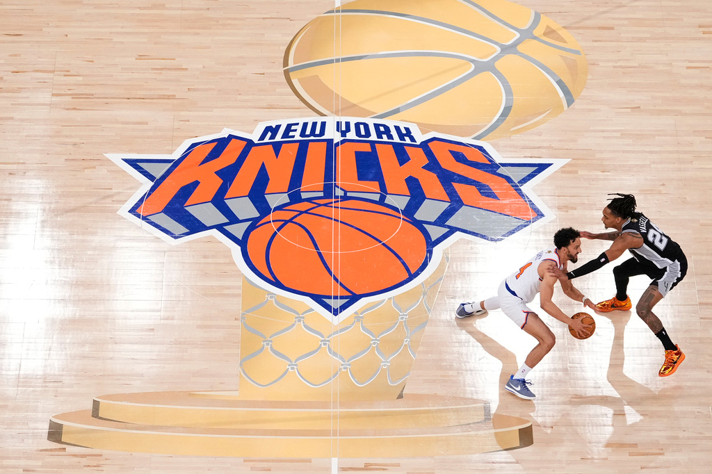 FILE - New York Knicks guard Landry Shamet (44) brings the ball up the court against San Antonio Spurs guard Devin Vassell (24) during the second half of Game 3 of the NBA Finals basketball series, June 8, 2026, in New York. (AP Photo/Yuki Iwamura, File)