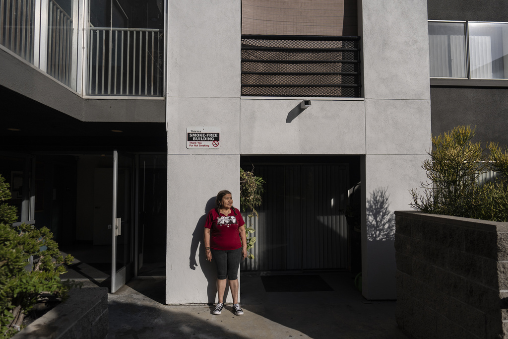 FILE - Marina Maalouf, a longtime resident of Hillside Villa who participated in protests after rents doubled in 2019, stands for a photo inside her apartment building in Los Angeles on Wednesday, Sept. 18, 2024. (AP Photo/Jae C. Hong,File)