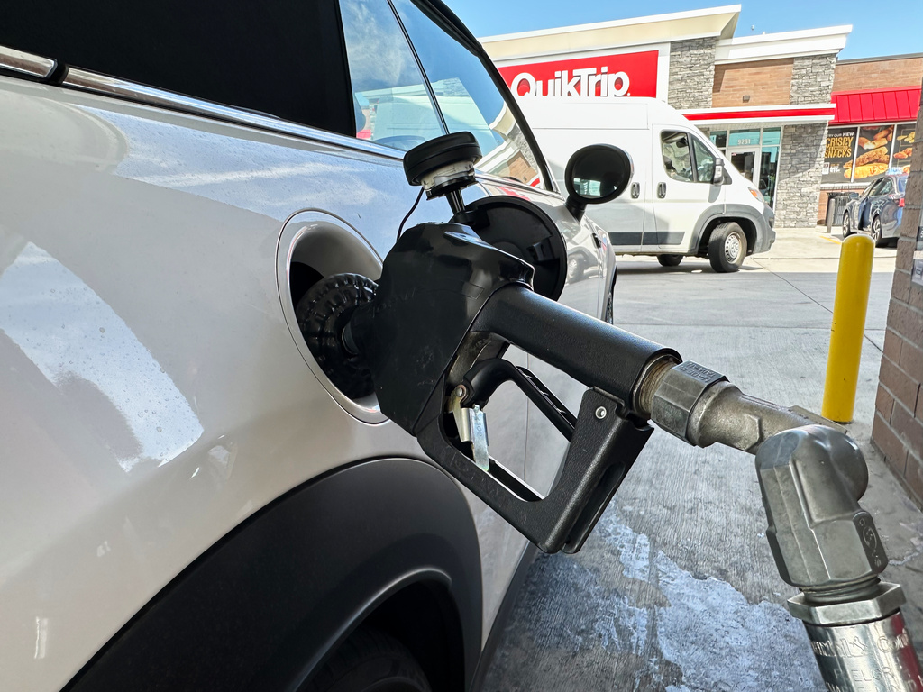 A motorist fills up the fuel tank of a vehicle at a QuikTrip gasoline stop Tuesday, Sept. 15, 2026, in Greenwood Village, Colo. (AP Photo/David Zalubowski)