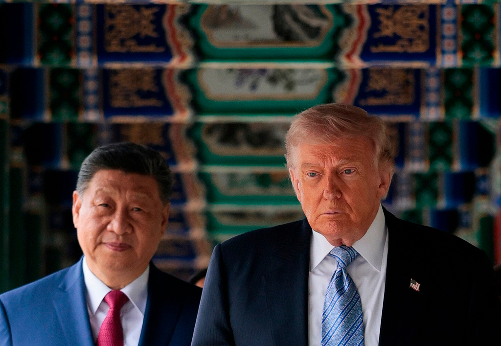 FILE - U.S. President Donald Trump, right, participates in a friendship walk through Zhongnanhai Garden with Chinese President Xi Jinping in Beijing, Friday, May 15, 2026. (Evan Vucci/Pool Photo via AP, File)