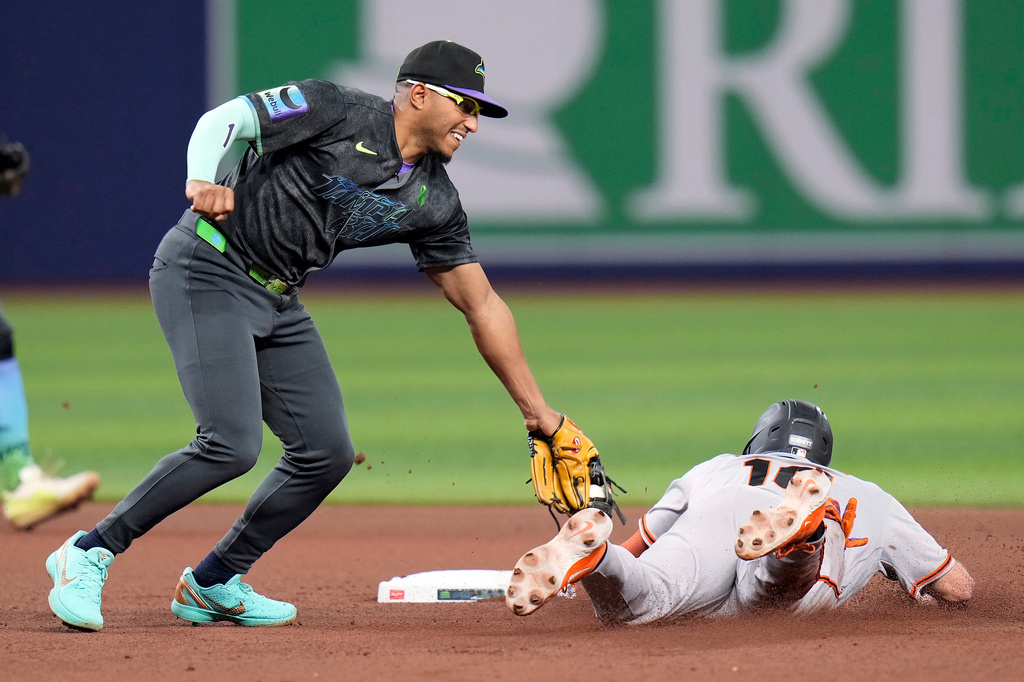 Tampa Bay Rays second baseman Richie Palacios tags out San Francisco Giants' Casey Schmitt (10) attempting to steals second base during the fourth inning of a baseball game Saturday, May 2, 2026, in St. Petersburg, Fla. (AP Photo/Chris O'Meara)