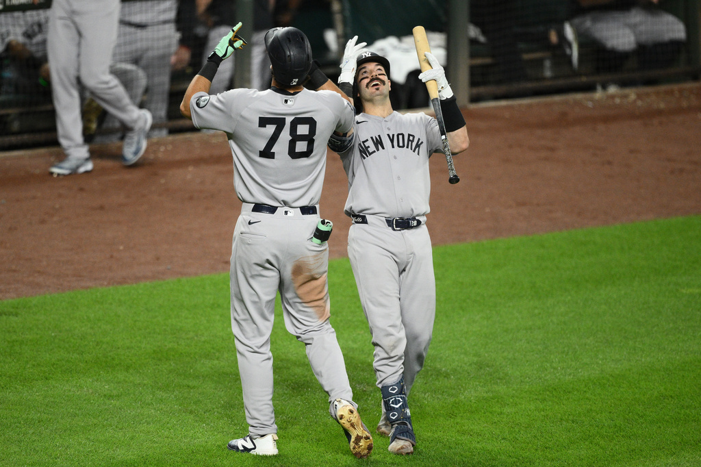 New York Yankees' Spencer Jones (78) celebrates after his solo home run with Austin Wells, right, during the sixth inning of a baseball game against the Baltimore Orioles, Thursday, Aug. 20, 2026, in Baltimore. (AP Photo/Nick Wass)