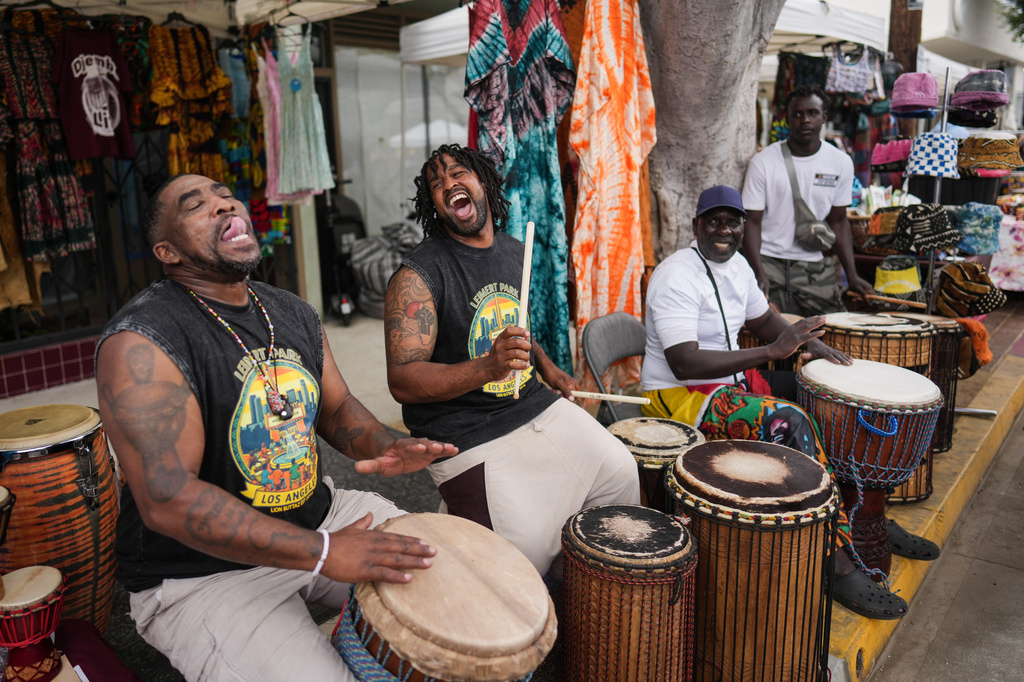 Drummers perform during a Juneteenth celebration in the Leimert Park neighborhood of Los Angeles, Friday, June 19, 2026. (AP Photo/Jae C. Hong)