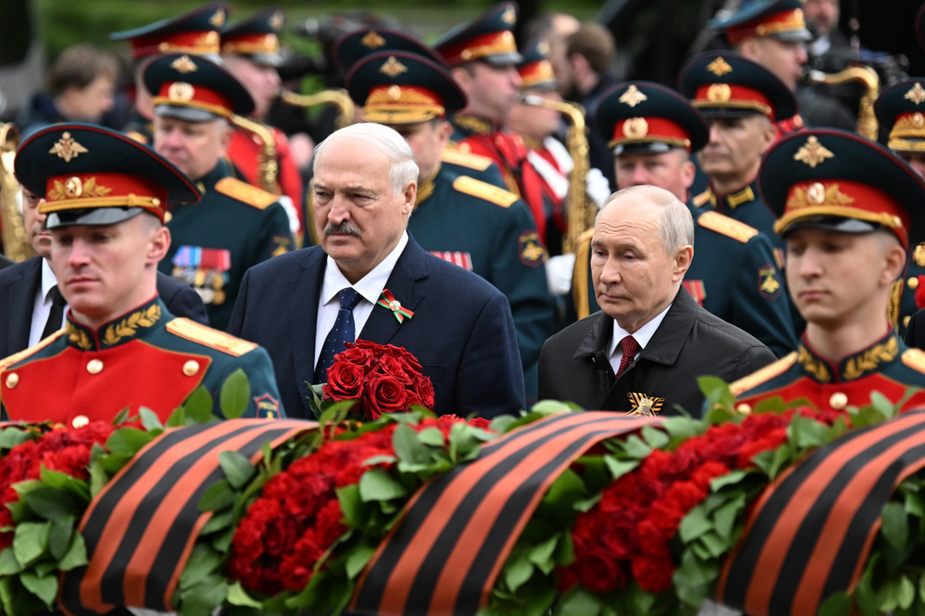 Russian President Vladimir Putin, left,and Belarusian President Alexander Lukashenko, attend a ceremony to lay flowers at the Tomb of the Unknown Soldier by the Kremlin wall inMoscow, Saturday, May 9, 2026, during celebrations of the 81st anniversary of the Soviet Union's victory over Nazi Germany during World War II. (Pelagiya Tikhonova, Sputnik, Kremlin Pool Photo via AP)