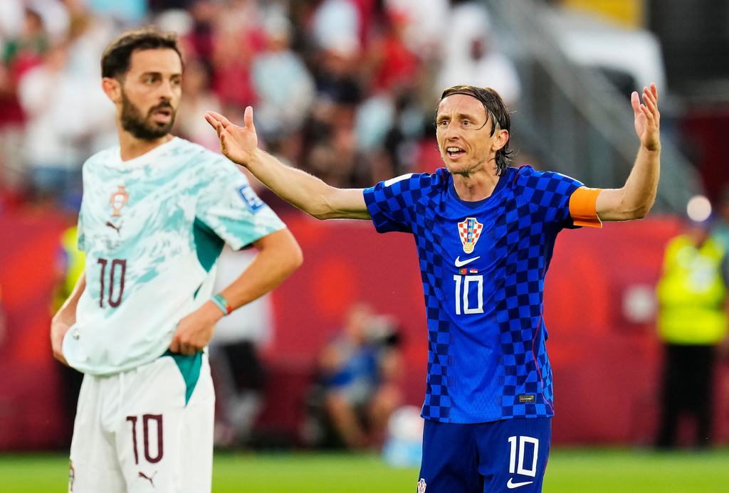 Croatia's Luka Modric (10) reacts to a call as Portugal's Bernardo Silva (10) looks on during the World Cup round of 32 soccer match between Portugal and Croatia in Toronto, Thursday, July 2, 2026. (Chris Young/The Canadian Press via AP)