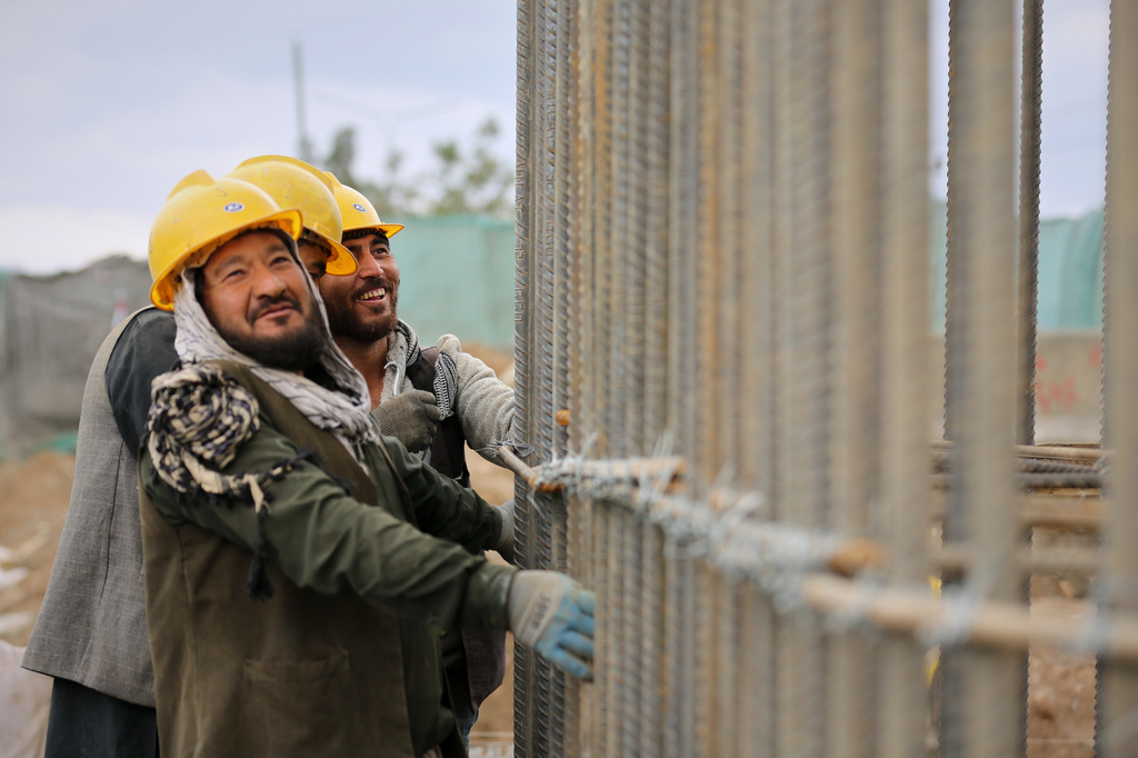 Afghan workers labor on the construction of an overpass through downtown Kabul, Afghanistan, Thursday, April 2, 2026. (AP Photo/Siddiqullah Alizai)