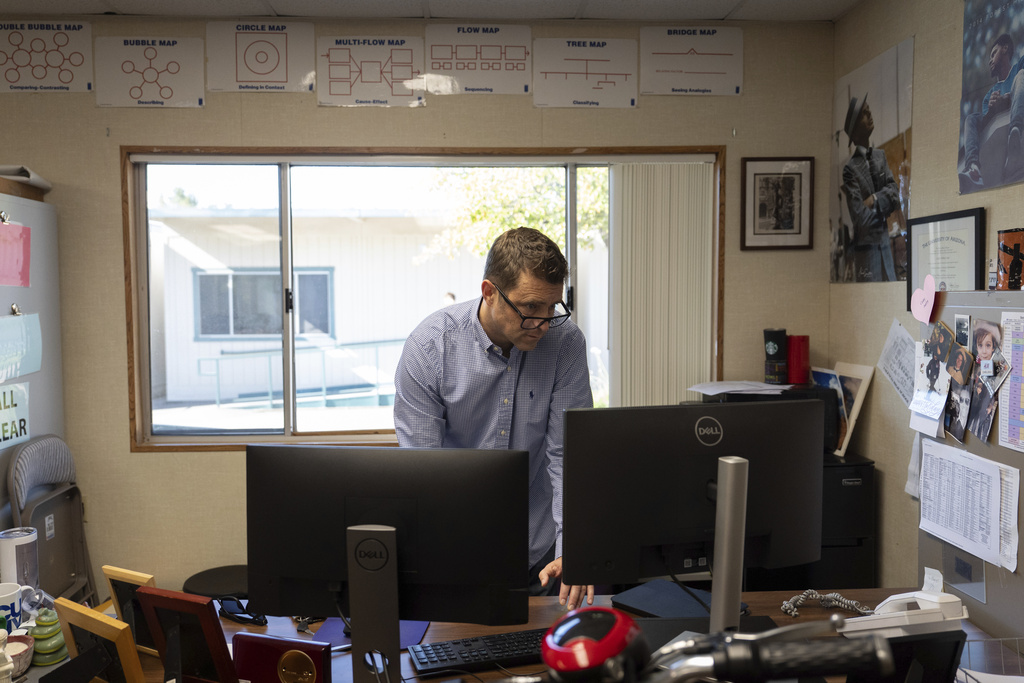 Casey Cuny, an English teacher at Valencia High School, works on his computer as he prepares for class in Santa Clarita, Calif., Wednesday, Aug. 27, 2025. (AP Photo/Jae C. Hong)