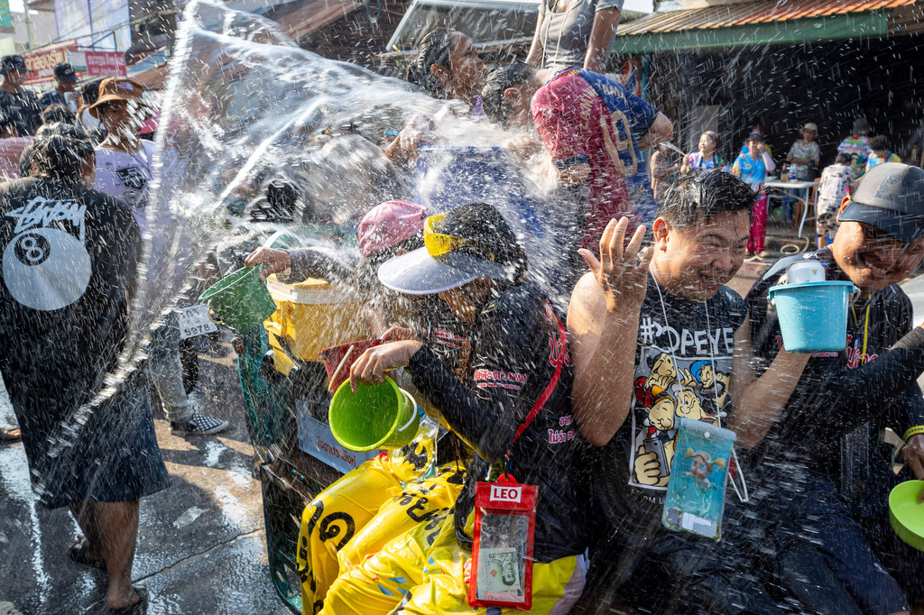 People participate in the Songkran water festival to celebrate the Thai New Year in Prachinburi province, Thailand, Monday, April 13, 2026. (AP Photo/Wason Wanichakorn)