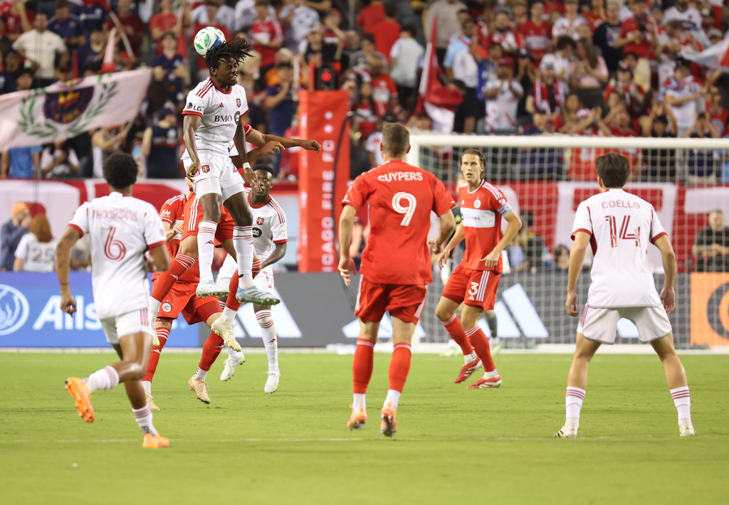 Toronto FC forward Deandre Kerr, top left, heads the ball during the first half of an MLS soccer match against the Chicago Fire, Saturday, Oct. 4, 2025, in Chicago. (AP Photo/Talia Sprague)