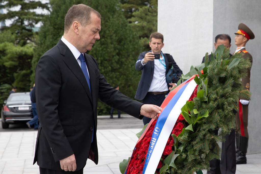 Russian Security Council Deputy Chairman and the head of the United Russia party Dmitry Medvedev attends a wreath laying ceremony at the statues of former North Korean leaders Kim Il Sung and Kim Jong Il on Mansu Hill in Pyongyang, North Korea, on Thursday, Oct. 9, 2025. (Ekaterina Shtukina, Sputnik Pool Photo via AP)
