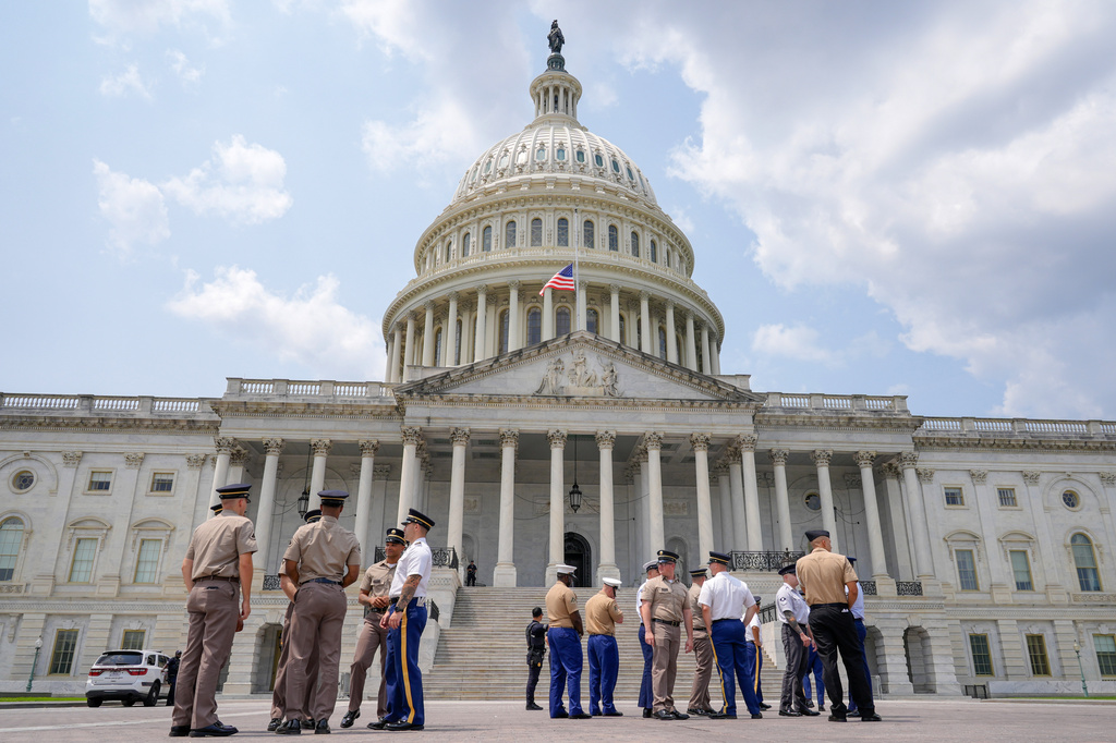 Members of the military stand outside of the U.S Capitol to practice for Sen. Lindsey Graham, R-S.C., is funeral ceremony, Monday, July 27, 2026, in Washington. (AP Photo/Mariam Zuhaib)