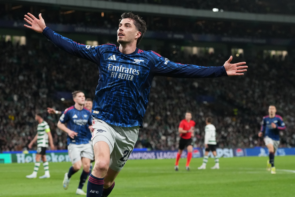 Arsenal's Kai Havertz celebrates after scoring his sides first goal during the Champions League quarterfinals, first leg, soccer match between Sporting CP and Arsenal, in Lisbon, Tuesday, April 7, 2026. (AP Photo/Armando Franca)