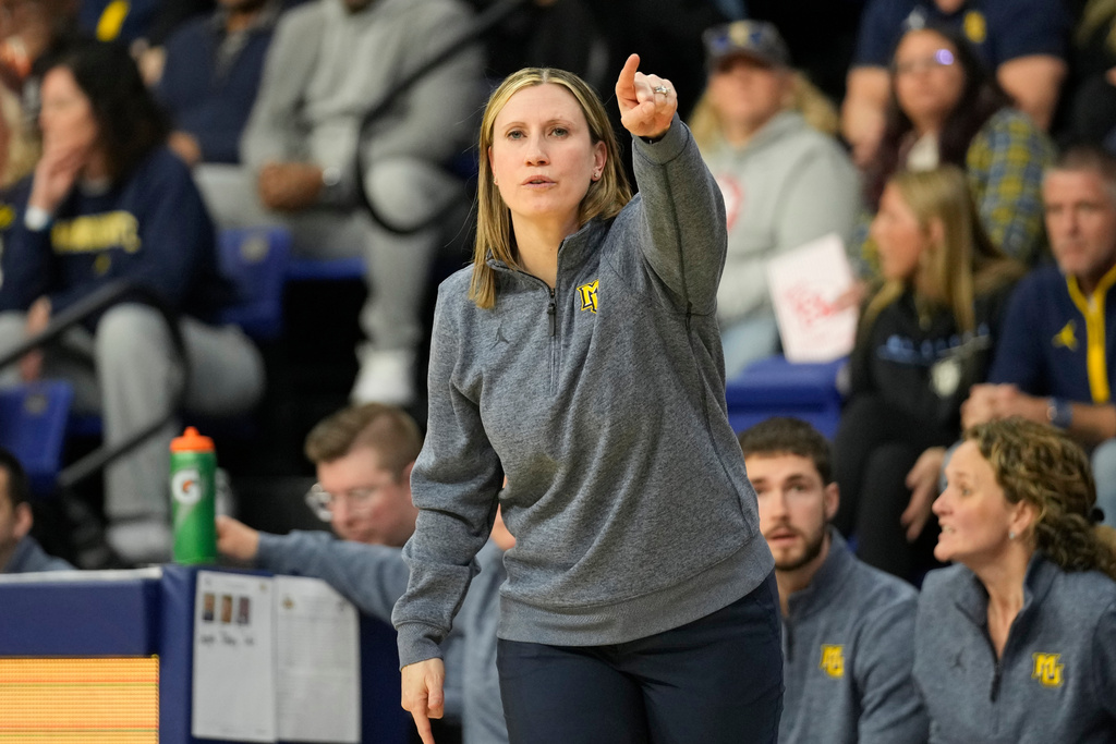 Marquette head coach Cara Consuegra directs her team during the first half of an NCAA college basketball game against UConn, Saturday, Feb. 14, 2026, in Milwaukee. (AP Photo/Kayla Wolf)