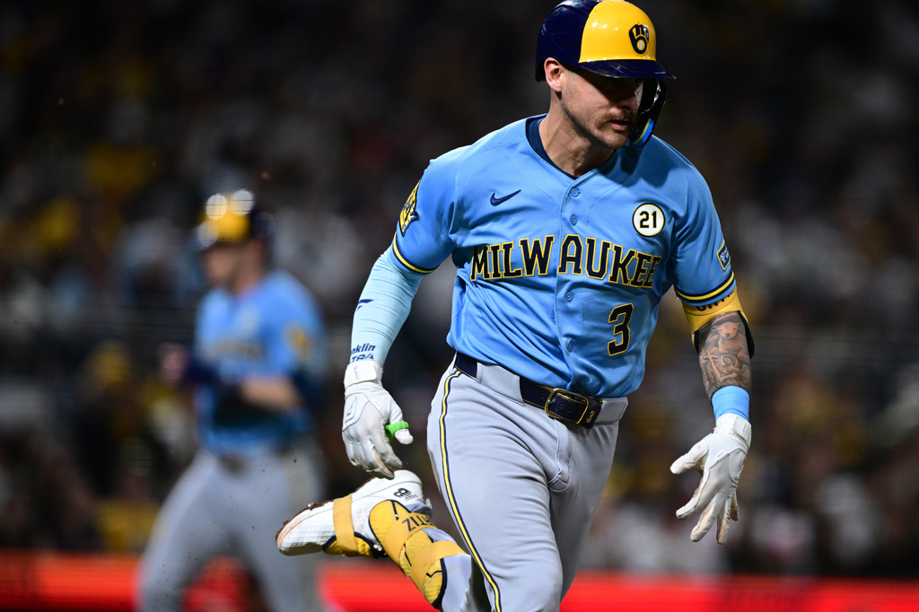 Milwaukee Brewers' Joey Ortiz runs to first base after hitting a two-RBI single during the sixth inning of a baseball game against the Pittsburgh Pirates, Tuesday, Sept. 15, 2026, in Pittsburgh. (AP Photo/David Dermer)