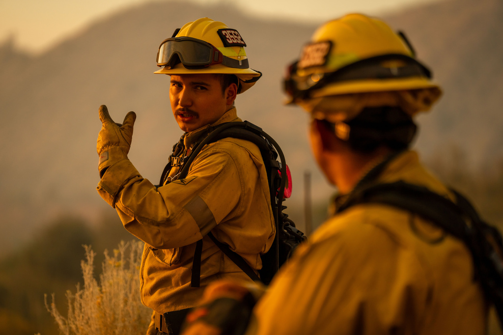 Firefighters work on the Summit Fire in Llano, CA. Friday, July 10, 2026. (AP Photo/Ethan Swope)