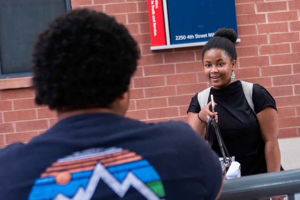 Howard University freshman Nikiyah Clark meets fellow students on move-in day, Thursday, Aug. 6, 2026, in Washington. (AP Photo/Allison Robbert)