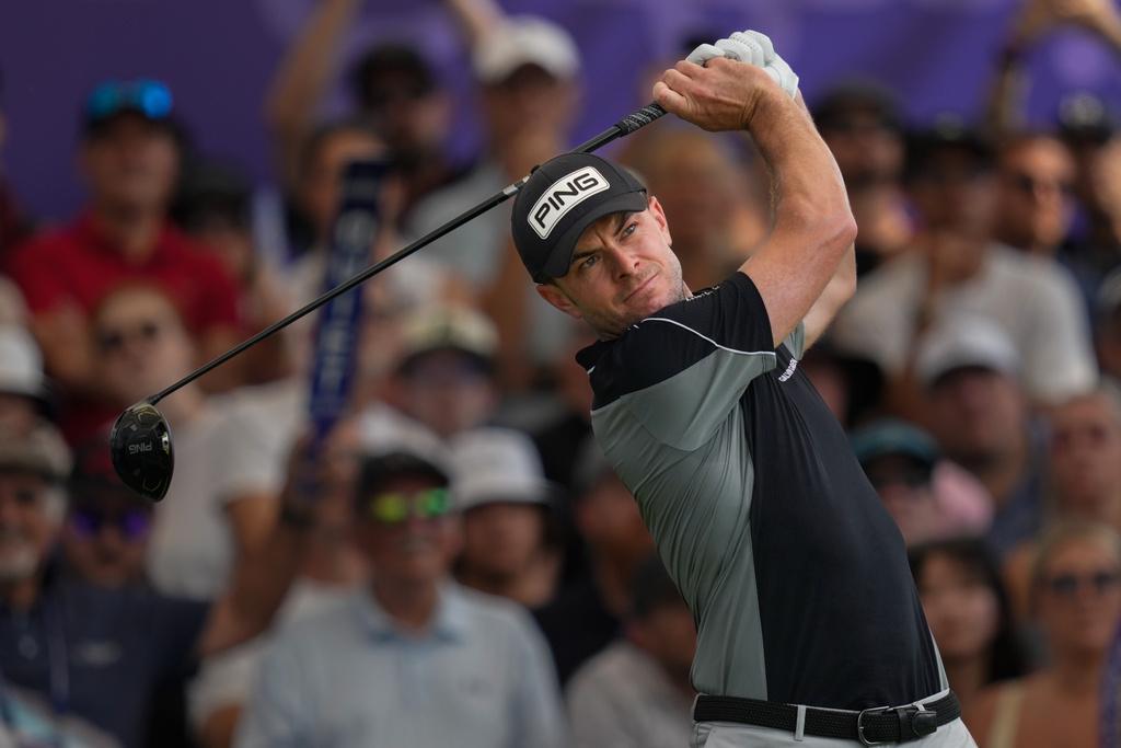 FILE - Laurie Canter of England hits off the first tee during the third round of World Tour Golf Championship at Jumeirah Golf Estates, in Dubai, United Arab Emirates, Nov. 15, 2025. (AP Photo/Altaf Qadri, File)
