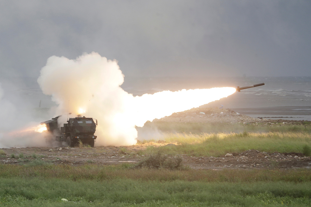 A rocket is launched from a High Mobility Artillery Rocket System (HIMARS) during a military live-fire shooting training in Taichung City, Taiwan, Wednesday, June 10, 2026. (AP Photo/Chiang Ying-ying)