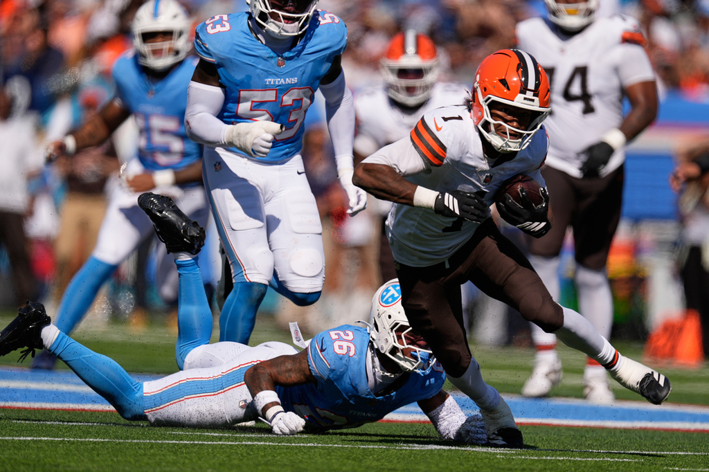 Cleveland Browns wide receiver KC Concepcion (1) gets past Tennessee Titans cornerback Marcus Harris (26) for a first down during the first half of an NFL football game in Nashville, Tenn., Sunday, Oct. 25, 2026. (AP Photo/George Walker IV)