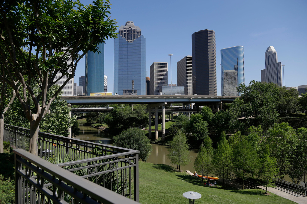 FILE - The Houston skyline overlooks the Buffalo Bayou as it snakes its' way into downtown April 18, 2014. (AP Photo/Pat Sullivan, File)