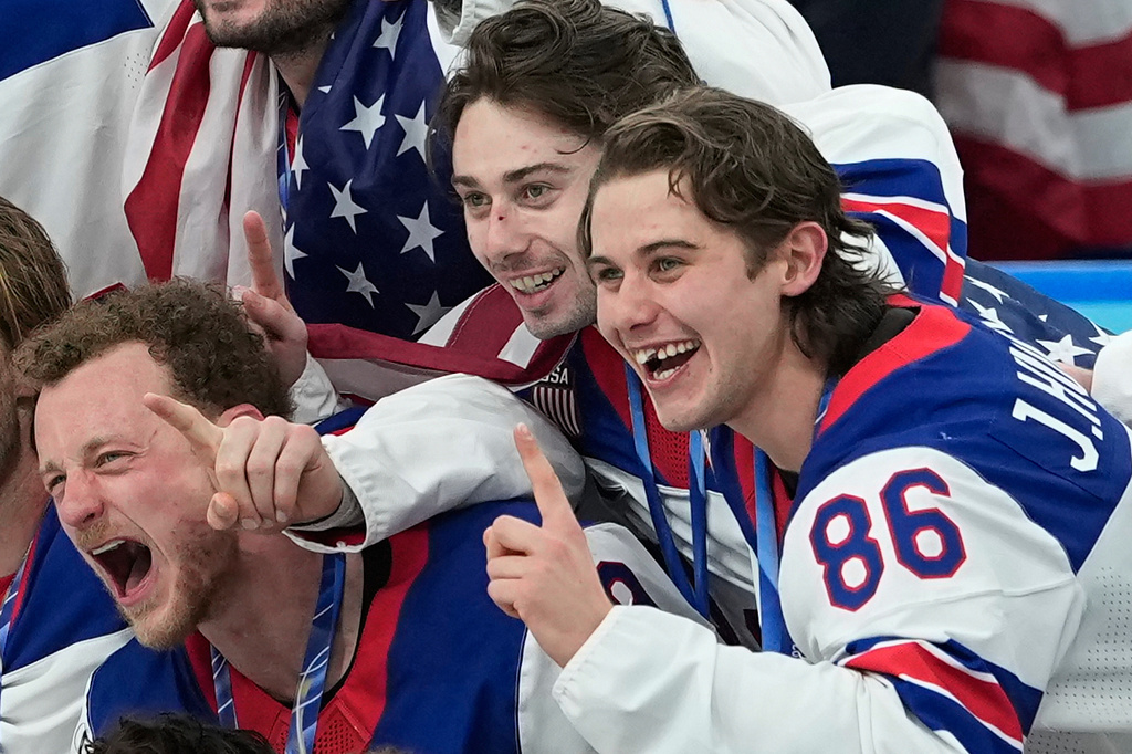 FILE - United States' Jack Hughes (86) poses with teammates after defeating Canada in the men's ice hockey gold medal game at the 2026 Winter Olympics, in Milan, Italy, Sunday, Feb. 22, 2026. (AP Photo/Petr David Josek, File)