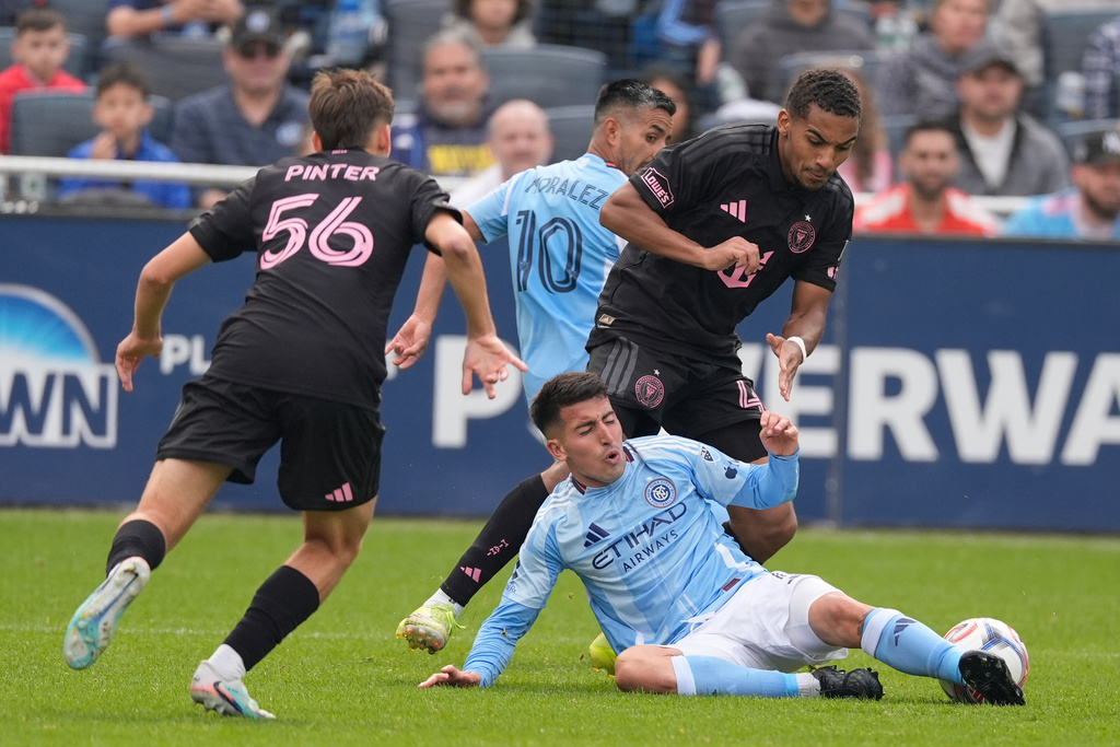 New York City FC's Nicolás Fernández, bottom right, and Inter Miami's Yannick Bright, right, fight for the ball during the second half of an MLS soccer game at Yankee Stadium in New York, Sunday, March 22, 2026. (AP Photo/Seth Wenig)