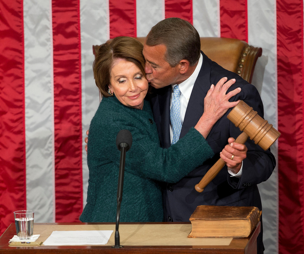 FILE - House Speaker John Boehner of Ohio, kisses House Minority Leader Nancy Pelosi of Calif. after being re-elected to a third term during the opening session of the 114th Congress, as Republicans assume full control for the first time in eight years, Jan. 6, 2015, on Capitol Hill in Washington. AP Photo/Pablo Martinez Monsivais, File)