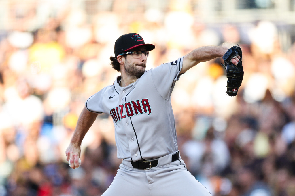Arizona Diamondbacks pitcher Zac Gallen winds up against a San Diego Padres' batter in the first inning of a baseball game Tuesday, July 7, 2026, in San Diego. (AP Photo/Derrick Tuskan)