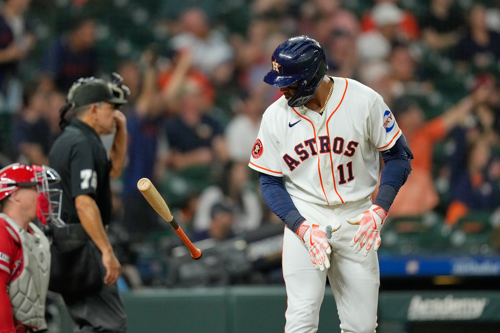 Houston Astros' Cam Smith (11) flips his bat after hitting a home run against the Los Angeles Angels during the eighth inning of a baseball game Tuesday, Aug. 18, 2026, in Houston. (AP Photo/David J. Phillip)