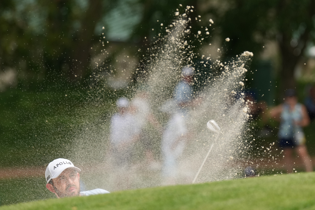 Patrick Cantlay hits out of a bunker on the nineth hole in the final round of the BMW Championship golf tournament, Sunday, Aug. 23, 2026, in St. Louis. (AP Photo/Jeff Roberson)