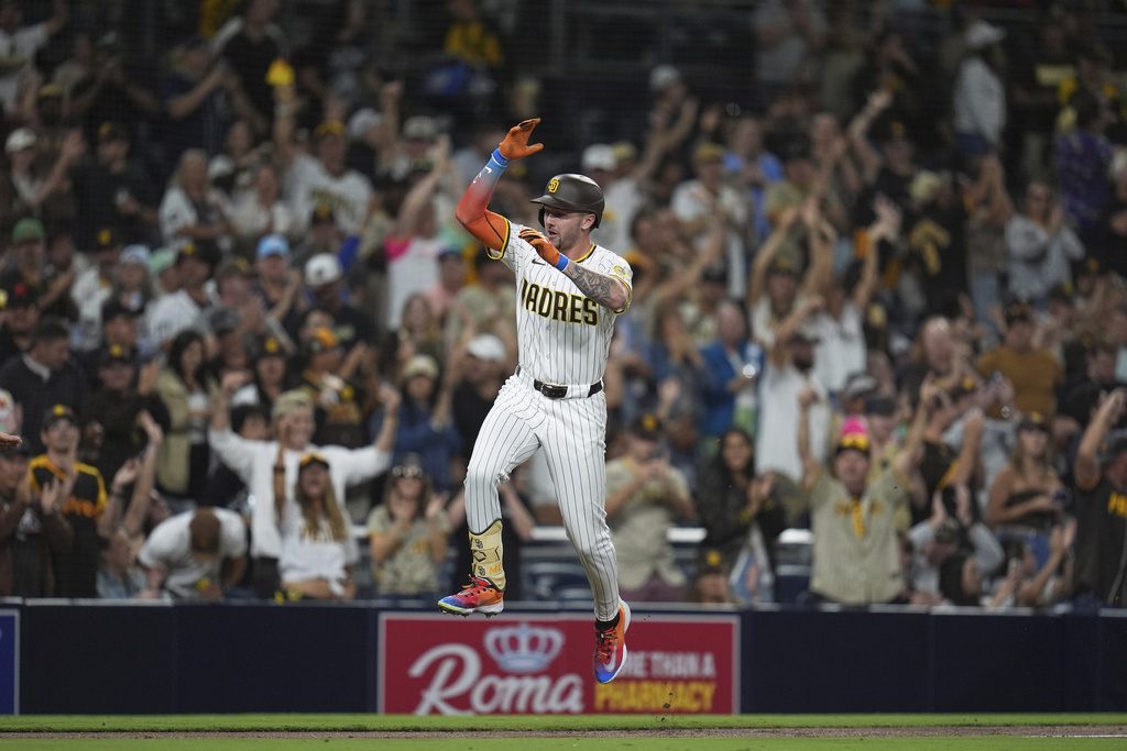 San Diego Padres' Jackson Merrill celebrates after hitting a home run during the fourth inning of a baseball game against the Colorado Rockies Thursday, Sept. 11, 2025, in San Diego. (AP Photo/Gregory Bull)