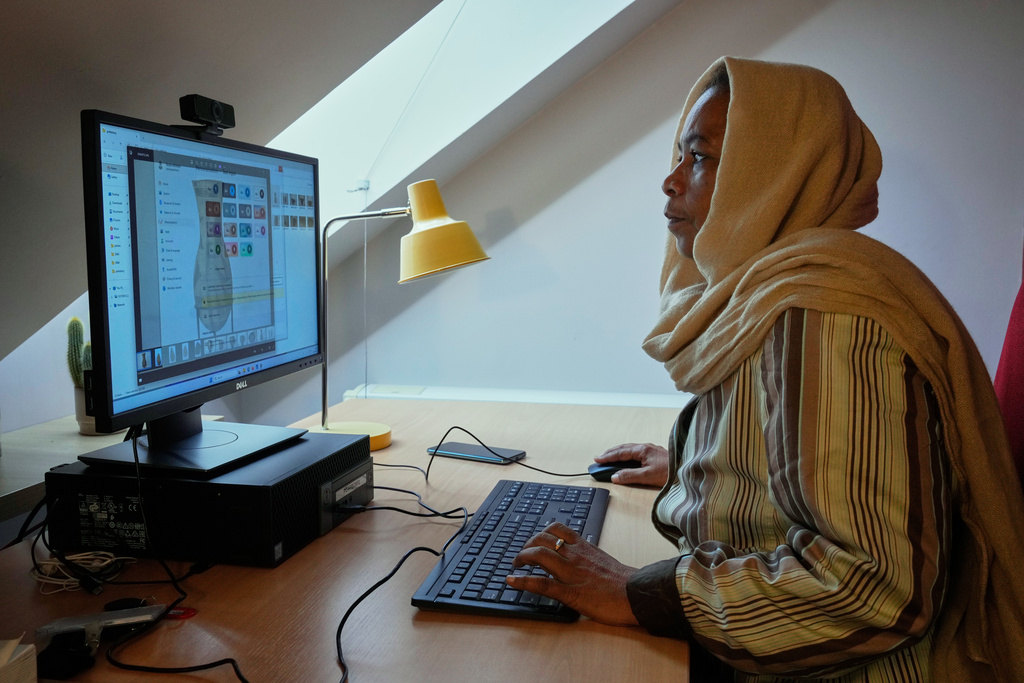 Archaeologist from Sudan's National Museum Dr Shadia Abdrabo, poses at her office at the French National Institute for Art History (INHA) in Paris, Wednesday, Oct. 29, 2025. (AP Photo/Michel Euler)