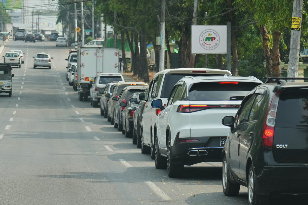 A line of vehicles wait to fill fuel at a gas station Tuesday, March 3, 2026, in Yangon, Myanmar. (AP Photo)