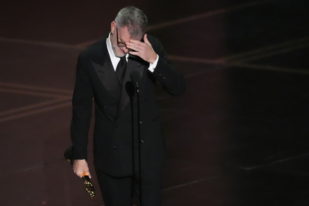 Paul Thomas Anderson accepts the award for directing for "One Battle After Another" during the Oscars on Sunday, March 15, 2026, at the Dolby Theatre in Los Angeles. (AP Photo/Chris Pizzello)