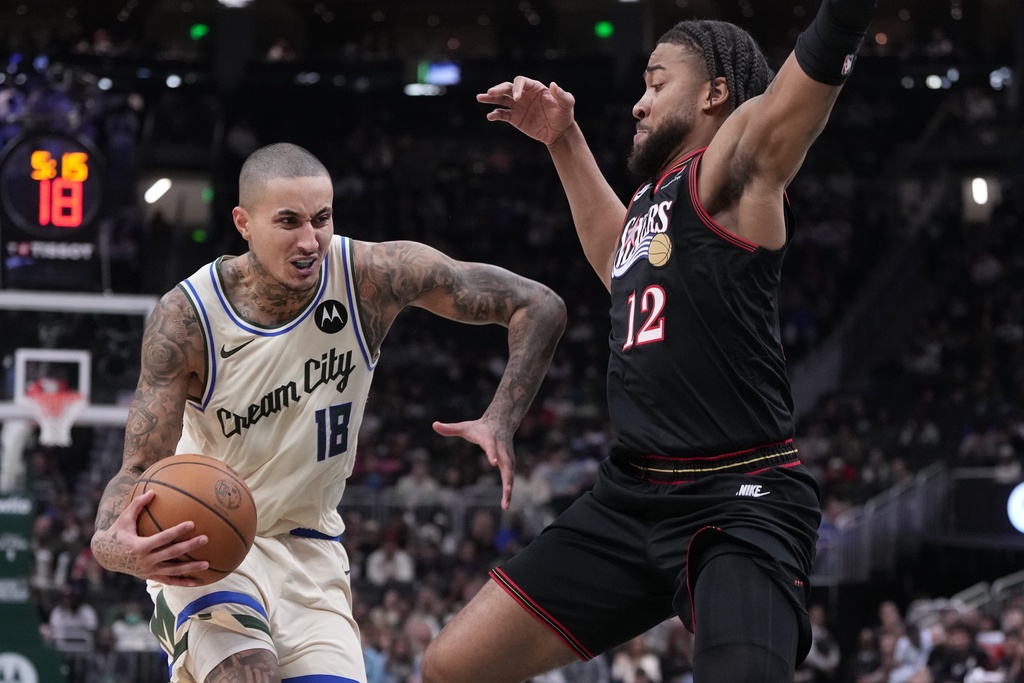Milwaukee Bucks' Kyle Kuzma tries to get by Philadelphia 76ers' Trendon Watford during the first half of an NBA basketball game Thursday, Nov. 20, 2025, in Milwaukee. (AP Photo/Morry Gash)