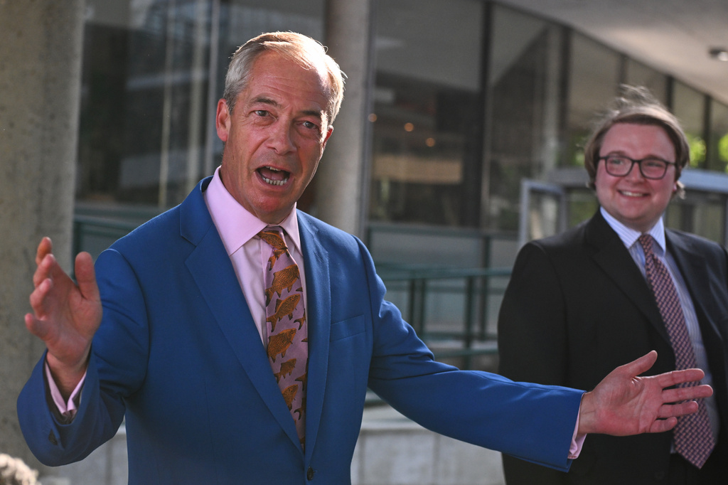 Britain's Reform UK leader Nigel Farage leaves Milbank Tower after he said he'll quit his Parliament seat and seek reelection in London, Tuesday, July 7, 2026.(AP Photo/Thomas Krych)
