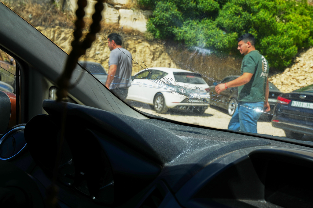A bullet hole is seen at the windshield of the shattered family vehicle of seven month old Palestinian baby boy Sam Fahd Abu Haikal, who was killed on Friday when Israeli soldiers fired at the vehicle carrying him and his parents, in Tel Rumeida, in the West Bank city of Hebron Saturday, June 6, 2026. (AP Photo/Mahmoud Illean)