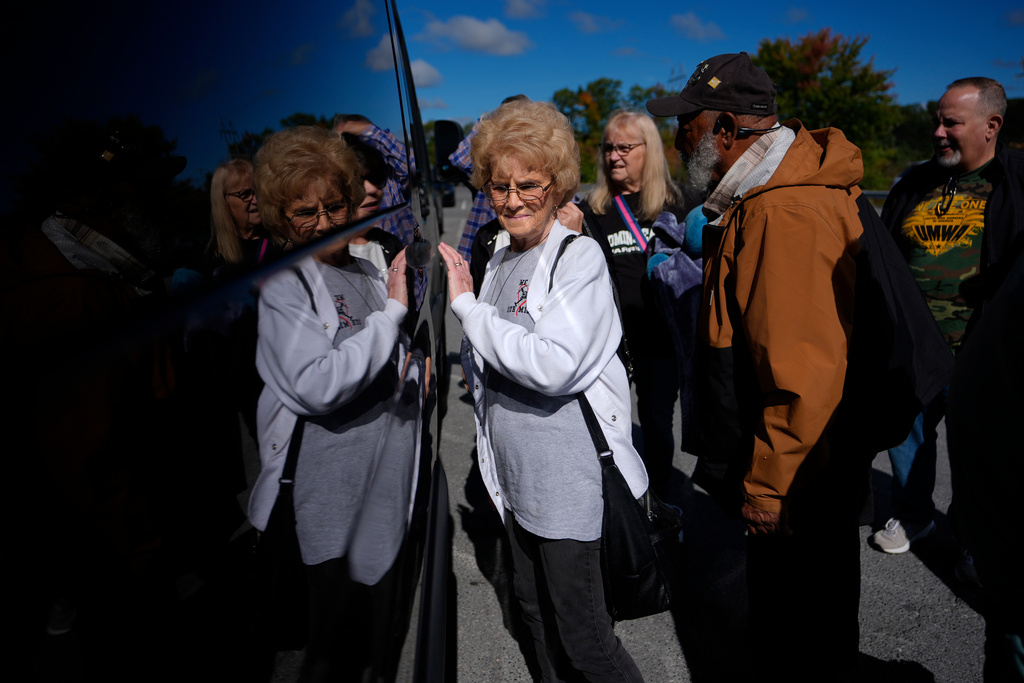 Judy Riffe, president of the Wyoming County Black Lung Association, left, and Gary Hairston, president of the Fayette County Black Lung Association and the National Black Lung Association, second from right, load into a van departing for Washington, D.C., to protest the government's delay of the silica rule passed last year to limit exposure to deadly silica in coal mines, on Oct. 13, 2025, in Mount Hope, W.Va. (AP Photo/Carolyn Kaster)